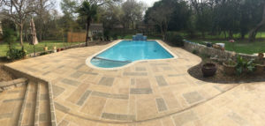 Colored concrete around a pool deck